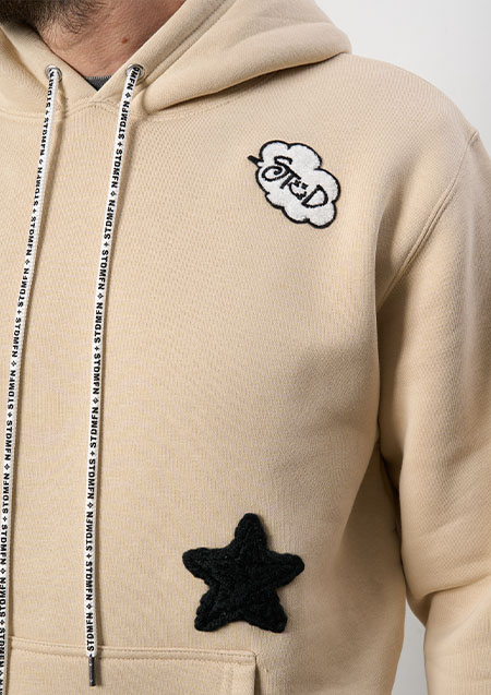 STUD MUFFIN 10ozT-C裏毛起毛 メニーパッチ＆スタープリントプルパーカー | BEIGE