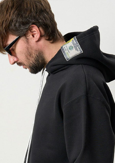 STUD MUFFIN TC裏毛起毛 ラベル&スマイル発泡プリントマルチパッチワーク プルパーカー | BLACK